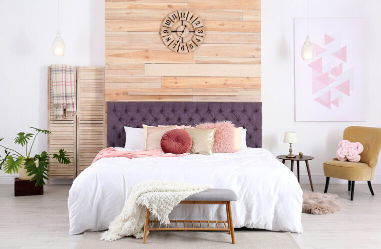 Bedroom with purple headboard