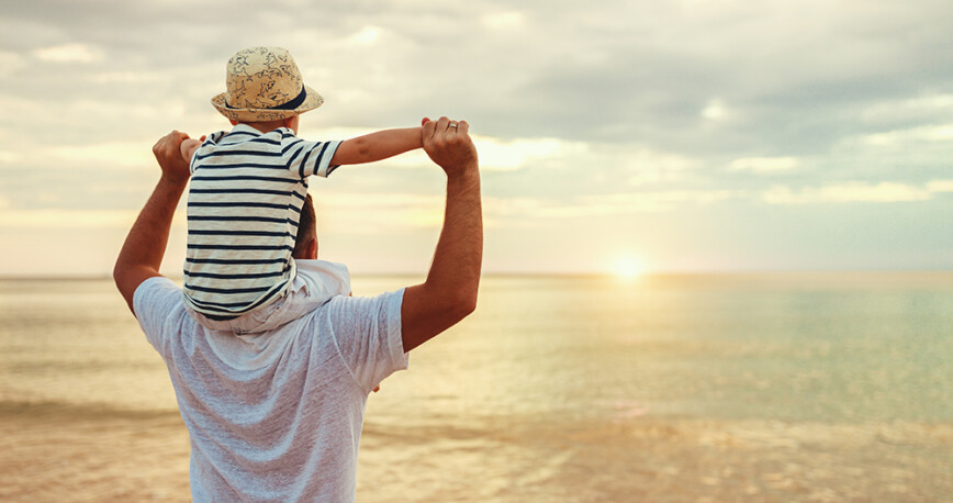 Dad with child at the beach