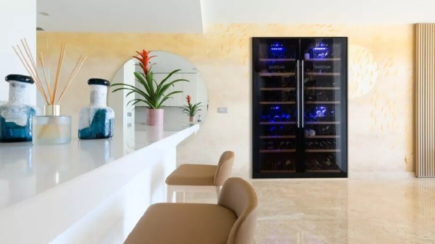 Openplan kitchen and breakfast bar with large wine cooler