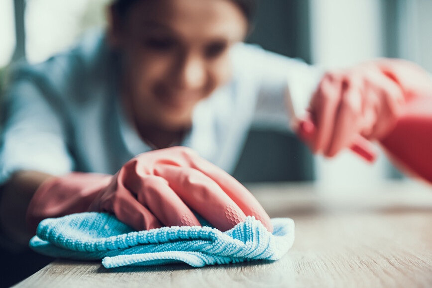 Women dusting, cleaning surfaces